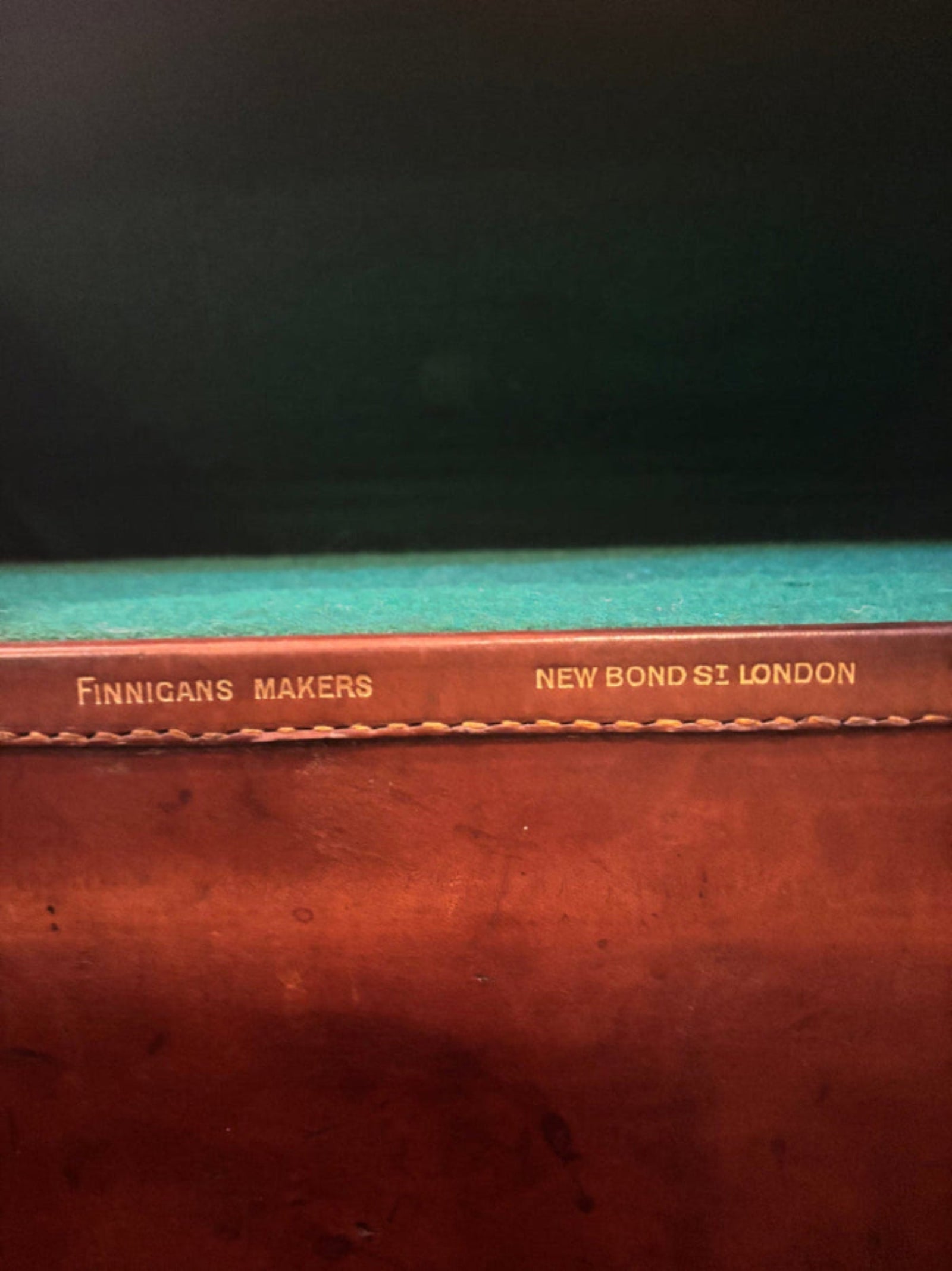 Close-up of a book with 'New Bonhams London' and 'Finnigan's Makers' text on the spine.