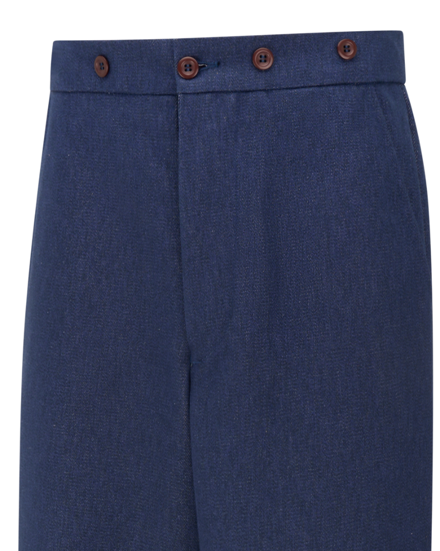Close-up of a pair of navy blue trousers showing the waistband with four decorative brown buttons, set against a plain white background.