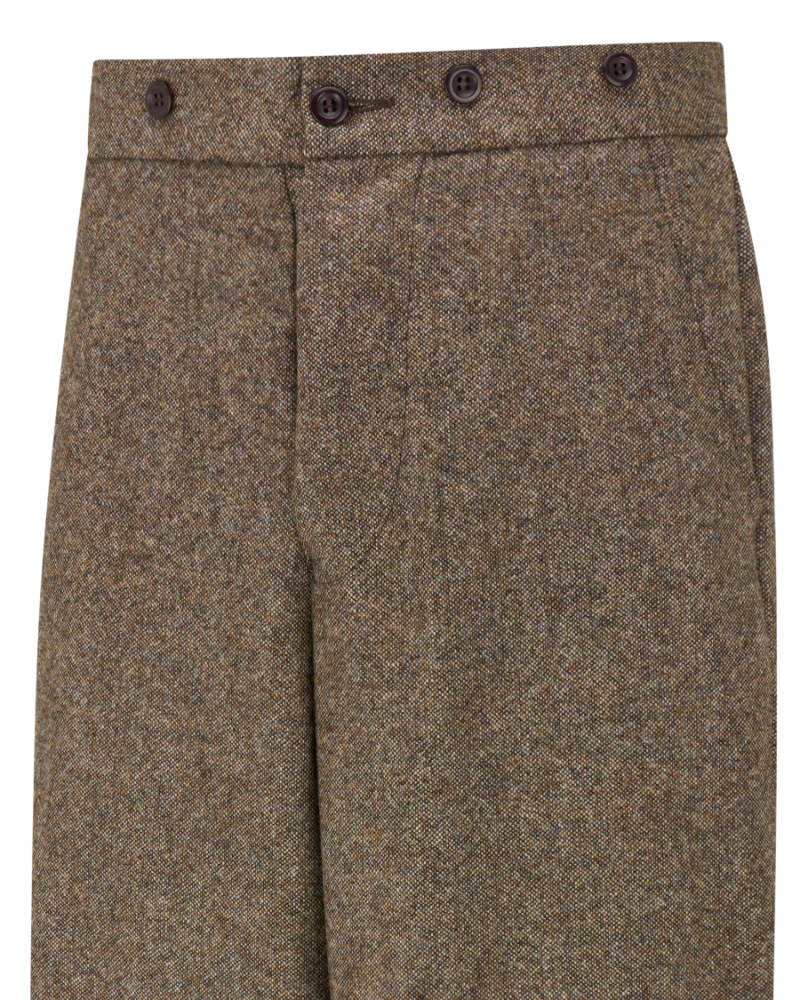 Close-up of a pair of tweed trousers in a brown and beige herringbone pattern, featuring a button waistband with three dark buttons.