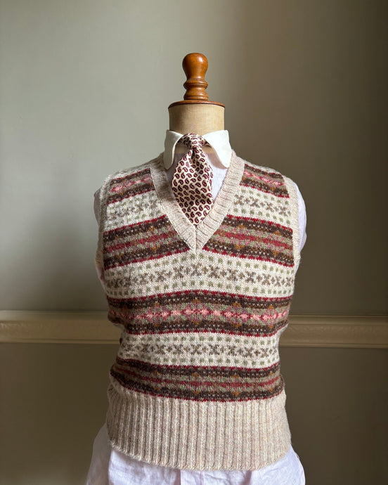 Brown and cream patterned Fair Isle sleeveless tank top with a v-neck.